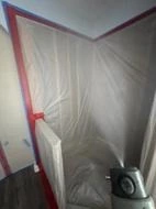 Air-filtration equipment inside the contained work area.