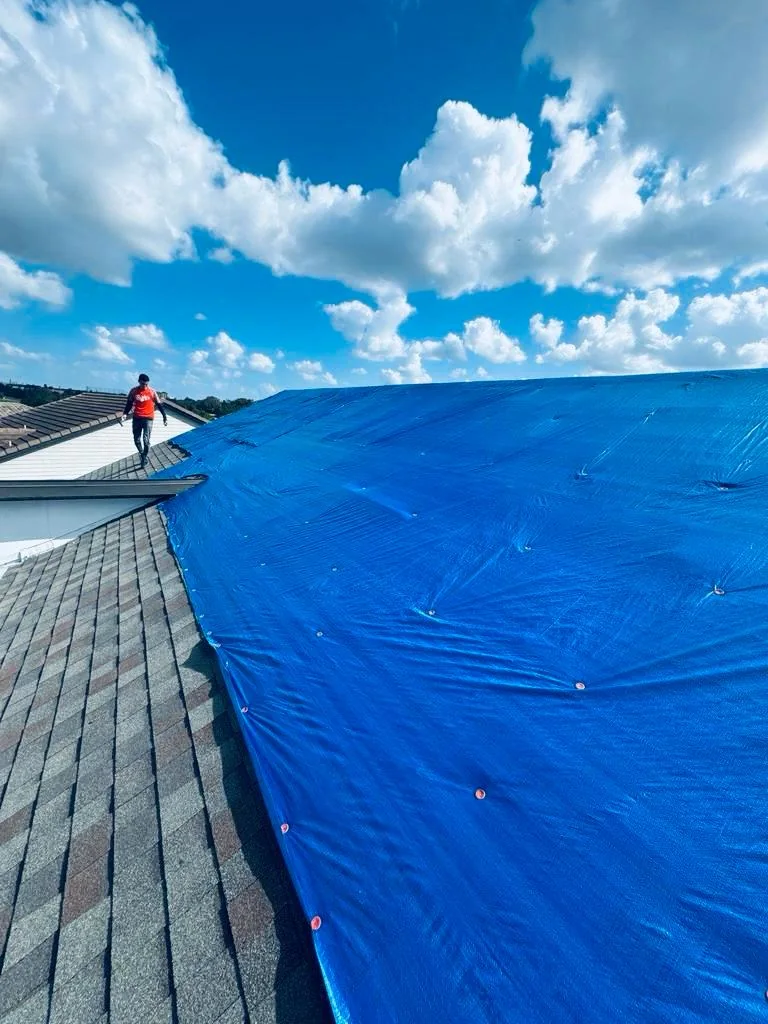 Hugo temporary roof tarp installed over a storm-damaged roof