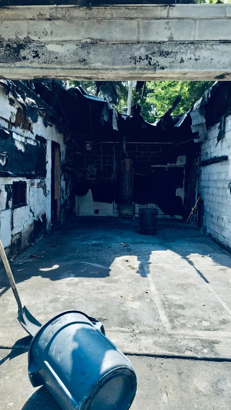 Fire-damaged room photographed before restoration cleanup