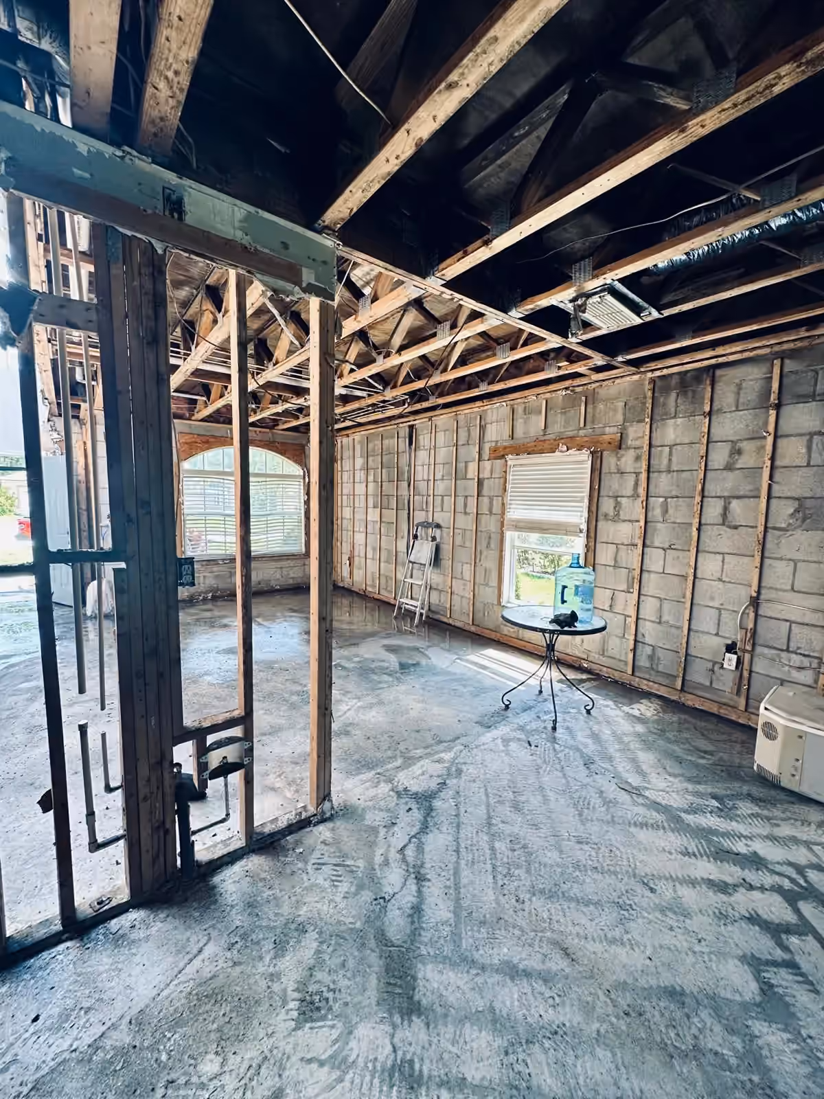 Fire-damaged interior after floor debris removal