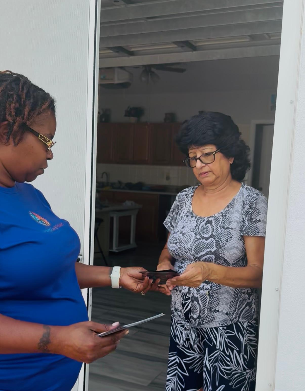 Property owner reviewing visible wall damage during an inspection