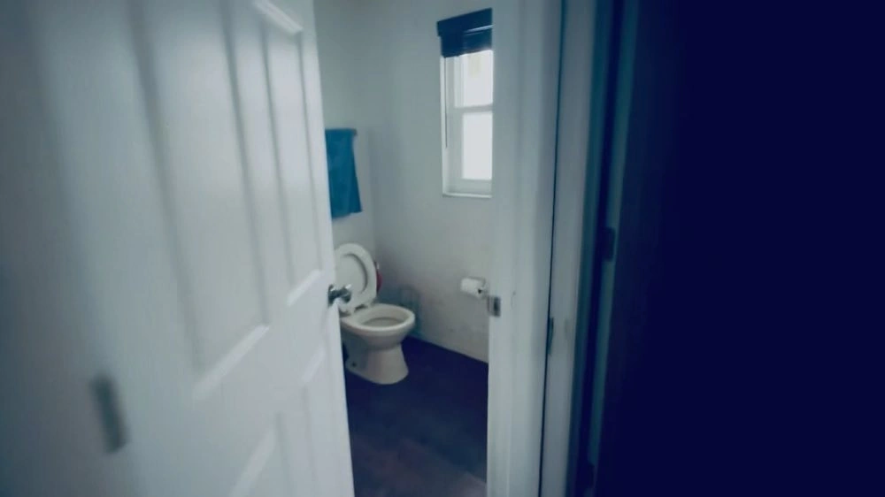 View through a doorway into a small bathroom